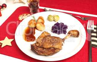 Roasted duck leg with bacon Brussels sprouts and red cabbage and