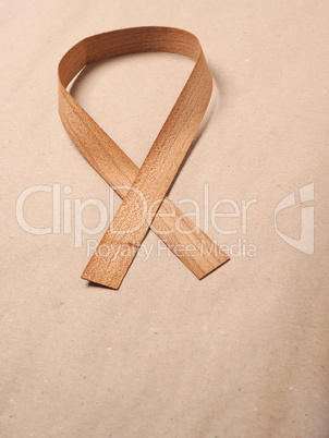 Wooden edge veneer curl on a natural paper,symbol for Liver Canc