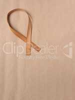 Wooden edge veneer curl on a natural paper,symbol for Liver Canc