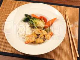 Red Thai curry with chicken and shrimps with fried vegetables an