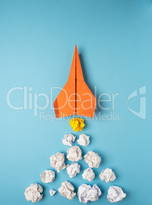 Launching paper rocket with jet stream of paper balls, creativit