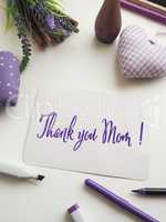 Thank you mother as brush lettering on a mother's day greeting c