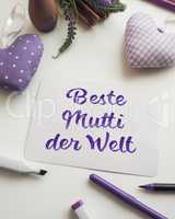 German Best mom of the world as brush lettering on a mother's da