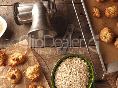 Oatmeal cookies on baking paper with organic baking ingredients