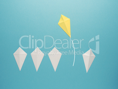 White paper kites in a row with a yellow paper kite flying away