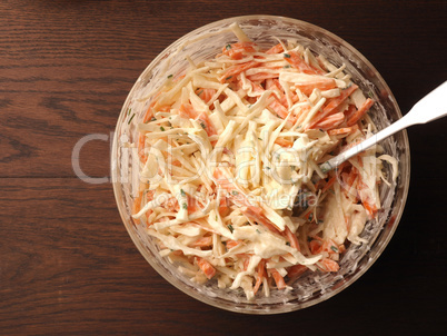 Traditional white cabbage salad with carrots ,chives, natural yo