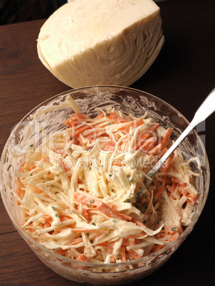 Traditional white cabbage salad with carrots ,chives, natural yo