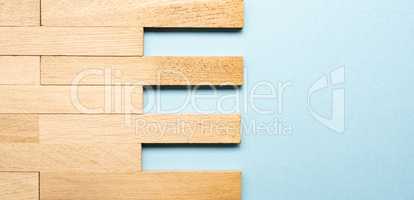 Solid wood parquet as wood texture on blue background with space