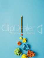 Launching pencil rocket with jet stream of paper balls, creativi