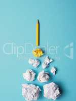 Launching pencil rocket with jet stream of paper balls, creativi