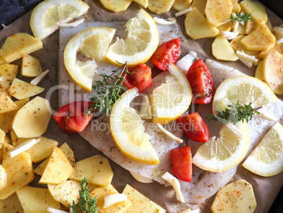 Cod fillet garnished with thyme garlic and tomatoes, preparation