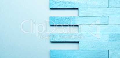 Solid wood parquet in blue as wood texture on blue background wi