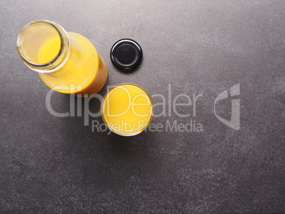 Organic orange juice on a stone table