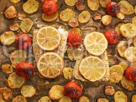 Cod fillet garnished with thyme garlic and tomatoes