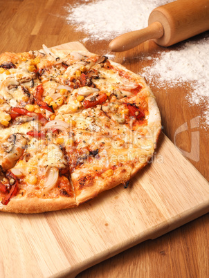 Delicious Vegetarian Pizza on a wooden board