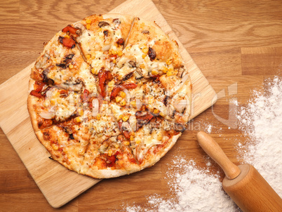 Delicious Vegetarian Pizza on a wooden board