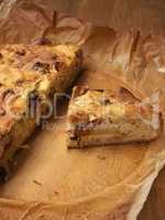 Quiche with potatoes and leeks on baking paper, vegetarian food