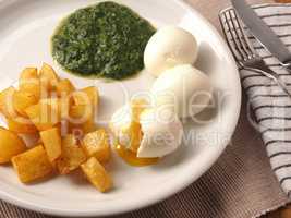 Organic spinach served with spicy potato cubes and boiled organi
