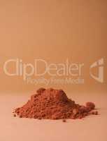 Chocolate powder on a brown background