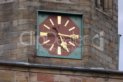 Clock with a gilded dial on the church