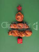 Yeast pastry decorated as Christmas tree on a green background