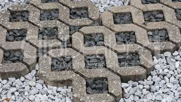 Part of a street with gray tiles and stones