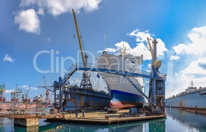 Large ship in dry dock of shipyard