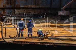 Dry dock workers in a Shipyard