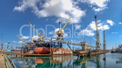 Large ship in dry dock of shipyard