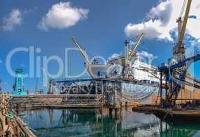 Large ship in dry dock of shipyard