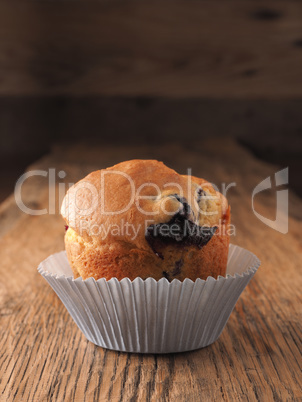 Blueberry muffin on a wooden kitchen table