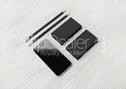 Smartphone, business cards, pencils