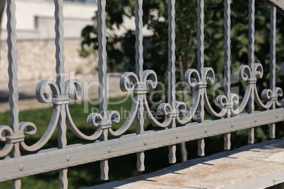 Metal fence. Metal curly fence in the park