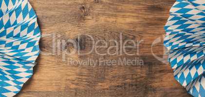 Banner with Bavarian flag on a rustic wooden table