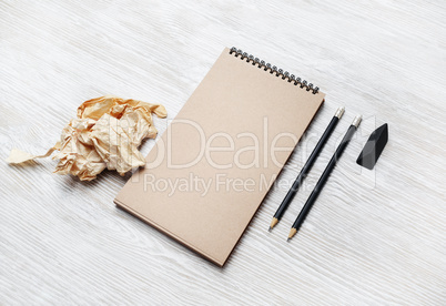 Notepad, pencil, eraser, crumpled paper