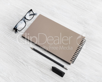 Kraft sketchbook, glasses, pencil, eraser
