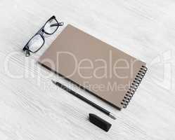 Kraft sketchbook, glasses, pencil, eraser