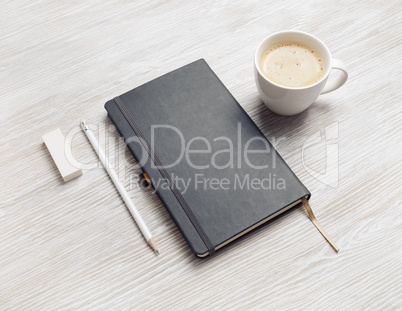 Notebook, pencil, eraser, coffee cup