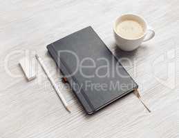 Notebook, pencil, eraser, coffee cup