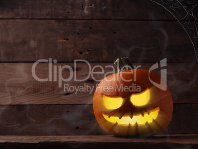 Carved halloween pumpkin Jack o lantner on a rustic wooden table