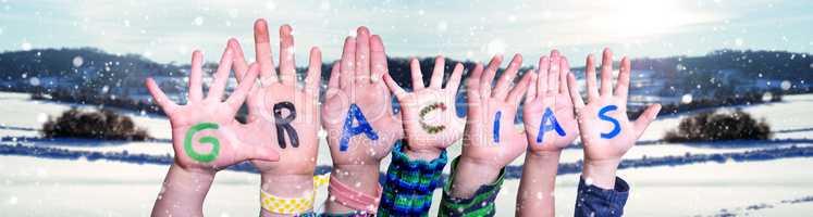 Children Hands Building Word Gracias Means Thank You, Snowy Winter Background