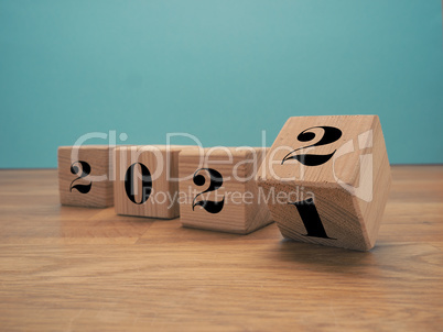 Flipping wooden cubes with the Year number 2021 and 2022, New Ye