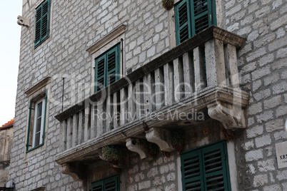 Balconies on old stone buildings in Croatia