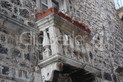 Balconies on old stone buildings in Croatia