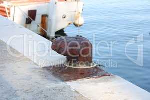 Bollard with a mooring line wrapped around it