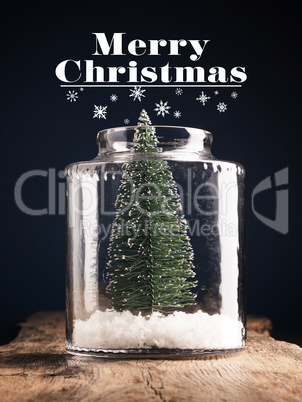 A Christmas tree in a jar with snow, Christmas greeting card