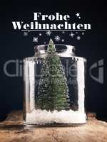 A Christmas tree in a jar with snow, Christmas greeting card