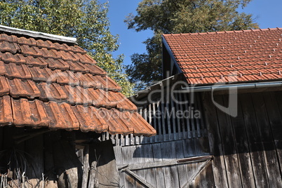 Shed roofs with old and new tiles