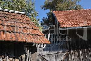 Shed roofs with old and new tiles