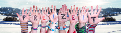 Children Hands Building Word Freizeit Means Leisure, Snowy Winter Background